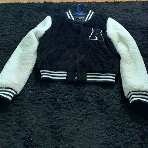 Fuzzy letterman jacket.